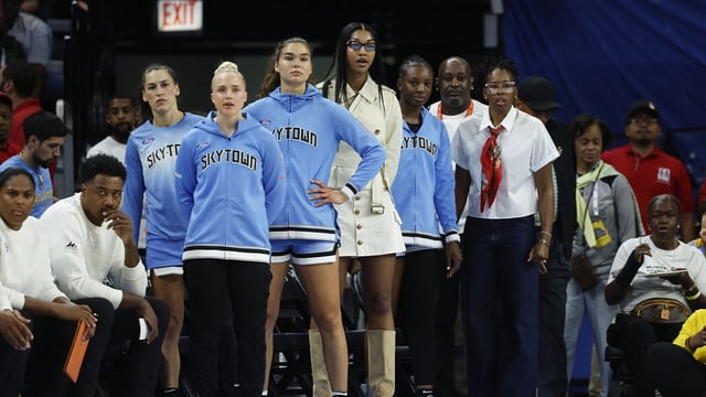 Aug 1, 2025; Chicago, Illinois, USA; Injured Chicago Sky forward Angel Reese (C) looks on from the bench during the first half of a WNBA game against the Golden State Valkyries at Wintrust Arena. Mandatory Credit: Kamil Krzaczynski-Imagn Images