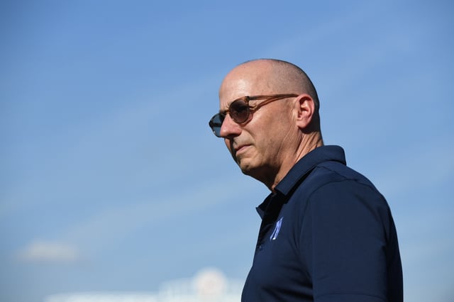 TAMPA, FLORIDA - MARCH 14: Brian Cashman, general manager and senior vice president of the New York Yankees, before a spring training game against the Philadelphia Phillies at George M. Steinbrenner Field on March 14, 2025 in Tampa, Florida.