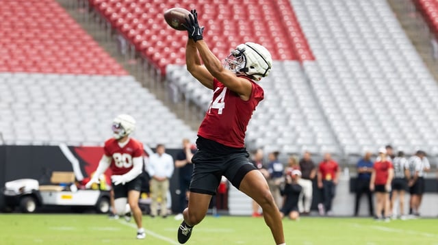 Jul 24, 2025; Glendale, AZ, USA; Arizona Cardinals wide receiver Michael Wilson (14) catches a pass during training camp at State Farm Stadium. Mandatory Credit: Mark J. Rebilas-Imagn Images