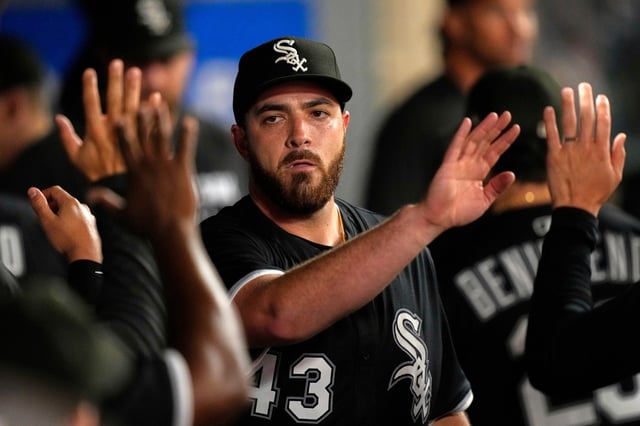 White Sox starting pitcher Aaron Civale is congratulated by teammates in the dugout after being taken out in the seventh inning, having given up only one hit against the Angels on  Saturday, Aug. 2, 2025, in Anaheim, Calif. (AP Photo/Mark J. Terrill)