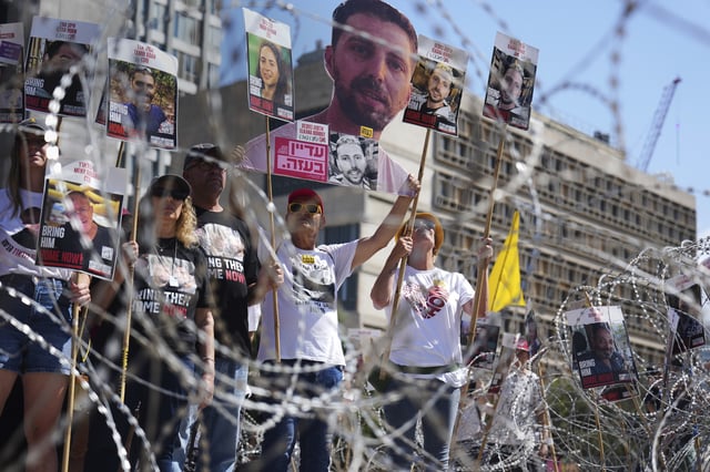 Families of hostages protest, demanding the release from Hamas captivity in the Gaza Strip, at the plaza known as the hostages square in Tel Aviv, Israel, Saturday, Aug. 2, 2025. (AP Photo/Ariel Schalit)