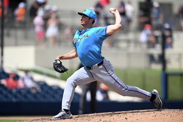 John Rooney, pitching for Miami against the Astros in spring training, is now joining Houston after being acquired for cash considerations from the Marlins.