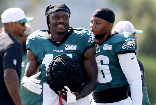 A.J. Brown #11 talks to Saquon Barkley #26 of the Philadelphia Eagles during the Philadelphia Eagles Training Camp at NovaCare Complex on July 28, 2025 in Philadelphia, Pennsylvania.