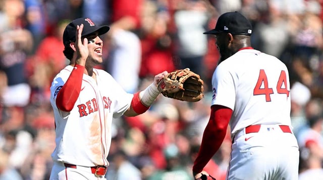 Jul 13, 2025; Boston, Massachusetts, USA; Boston Red Sox pitcher Aroldis Chapman (44) high-fives third base Marcelo Mayer (39) after a game against the Tampa Bay Rays at Fenway Park. Mandatory Credit: Brian Fluharty-Imagn Images