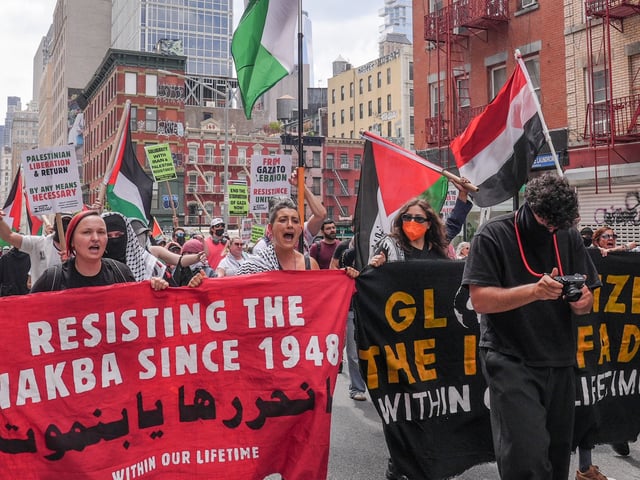 NEW YORK CITY, UNITED STATES - AUGUST 2: Pro-Palestinian Americans, holding banners and Palestinian flags, take to Manhattan streets to demand 'an end to the siege on Gaza and the entry of essential food into Gaza, August 2, 2025, New York City, United States. (Photo by Selcuk Acar/Anadolu via Getty Images)