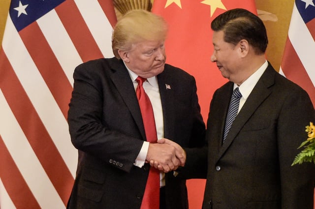 US President Donald Trump shakes hand with China&#39;s President Xi Jinping at the end of a press conference at the Great Hall of the People in Beijing on November 9, 2017.