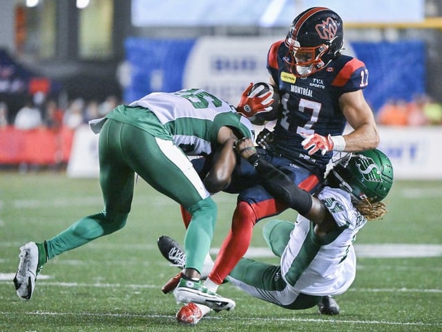 Montreal Alouettes' Cole Spieker (17) is brought down by Saskatchewan Roughriders'  Tevaughn Campbell (26) and C.J. Reavis (1) during second half CFL football action in Montreal, Saturday, Aug. 2, 2025.