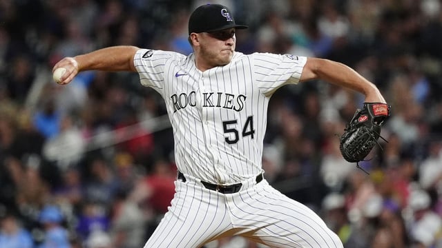 Jul 22, 2025; Denver, Colorado, USA; Colorado Rockies relief pitcher Seth Halvorsen (54) delivers a pitch in the ninth inning against the St. Louis Cardinals at Coors Field. Mandatory Credit: Ron Chenoy-Imagn Images