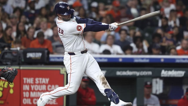 Jul 29, 2025; Houston, Texas, USA; Houston Astros first baseman Christian Walker (8) hits a single during the fifth inning against the Washington Nationals at Daikin Park. Mandatory Credit: Troy Taormina-Imagn Images