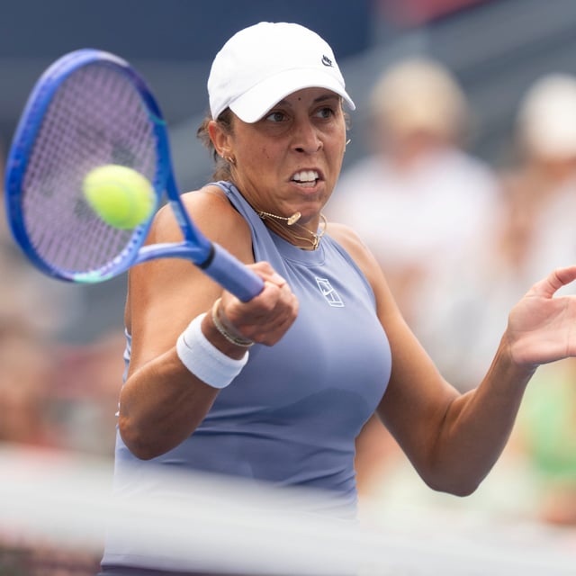 Madison Keys of the United States hits a return to Karolina Muchova of Czechia during round of 16 tennis action at the National Bank Open in Montreal, Sunday, Aug. 3, 2025. THE CANADIAN PRESS/Christinne Muschi