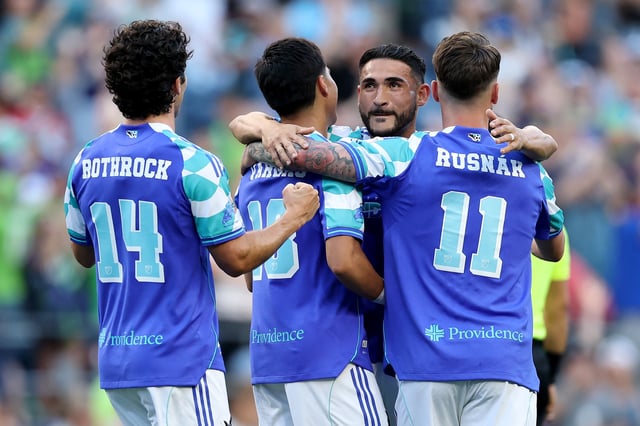 Cristian Roldan #7 celebrates with Obed Vargas #18, Albert Rusnák #11 and Paul Rothrock #14 of Seattle Sounders after a goal by Vargas against the Colorado Rapids during the first half at Lumen Field on July 16, 2025 in Seattle, Washington.