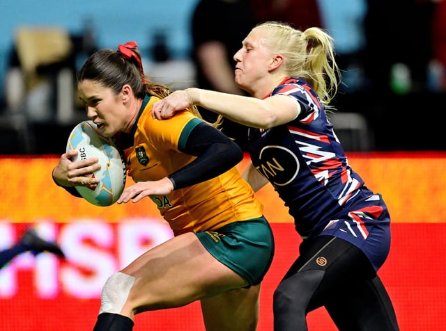 Rugby Union - HSBC Sevens - Australia v Britain - Cup Quarter Final - Vancouver - BC Place, Vancouver, Canada - February 22, 2025 Australia's Charlotte Caslick in action with Britain's Heather Cowell REUTERS/Jennifer Gauthier/File Photo