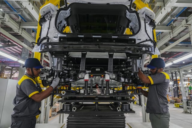 Workers assemble a car at the Vinfast electric vehicle plant in Thoothukudi, in the southern Indian state of Tamil Nadu, Monday, Aug. 4, 2025. (AP Photo/ Rafiq Maqbool)