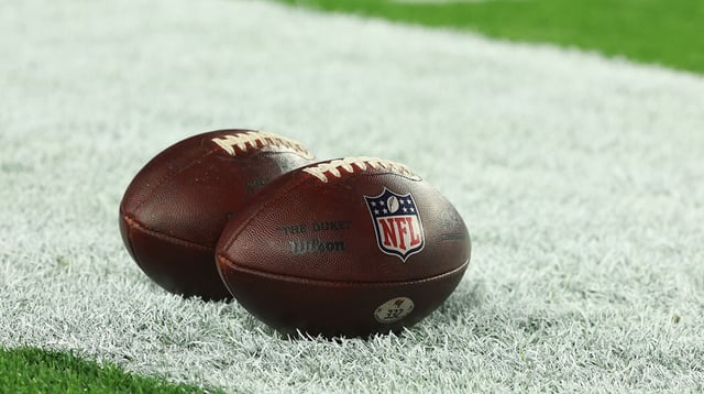 Jan 15, 2024; Tampa, Florida, USA; Official NFL game balls sit on the field prior to a 2024 NFC wild card game between the Philadelphia Eagles and Tampa Bay Buccaneers at Raymond James Stadium. Mandatory Credit: Kim Klement Neitzel-Imagn Images
