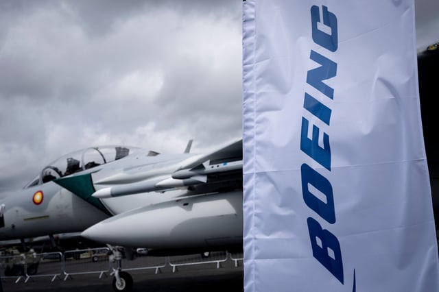 A Boeing banner and an F-15EX jet fighter during the Farnborough International Airshow, on 22nd July 2024, at Farnborough, England. The McDonnell Douglas F-15 Eagle is an American twin-engine fighter aircraft designed by McDonnell Douglas which is now part of Boeing. The bi-annual Farnborough International airshow this year hosts 1,500 exhibitors with 100,000sqm of exhibition space with over 80,000 visitors over the 5 day-long trade days. (Photo by Richard Baker / In Pictures Via Getty Images)