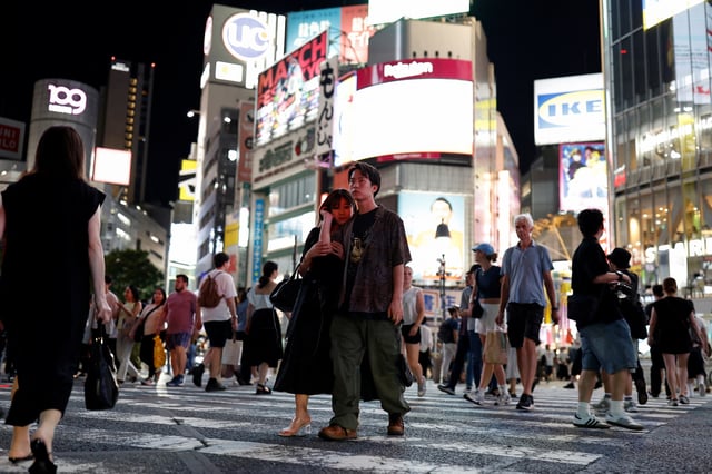 People walk at Shibuya crossing in Tokyo, Japan, August 4, 2024. REUTERS/Willy Kurniawan/File Photo
