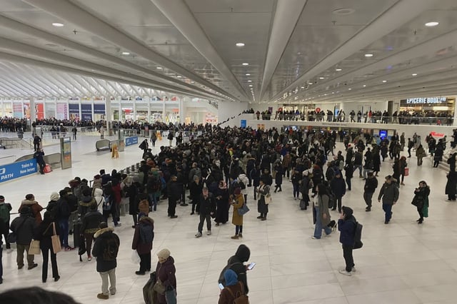 Crowds form as PATH train service is halted on Thursday evening.