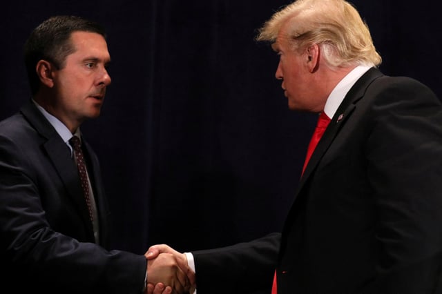 U.S. President Donald Trump shakes hands with Representative Devin Nunes (R-CA) after signing a presidential memorandum focused on water policy in California's Central Valley, at a conference center in Scottsdale, Arizona, U.S., October 19, 2018. REUTERS/Jonathan Ernst/File Photo