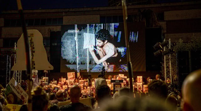 An image of Evyatar David from a video released by Hamas is shown at a rally in Tel Aviv, Aug. 2, 2025. (Ori Aviram/Middle East Images via AFP/Getty Images)