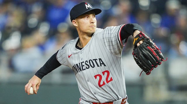 Apr 9, 2025; Kansas City, Missouri, USA; Minnesota Twins relief pitcher Griffin Jax (22) pitches against the Kansas City Royals at Kauffman Stadium. Mandatory Credit: Jay Biggerstaff-Imagn Images