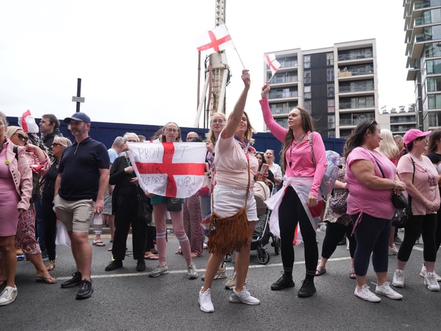 People during a protest near the Britannia International Hotel in Canary Wharf, London where asylum seekers are planned to be housed. Picture date: Sunday August 3, 2025. (Photo by Lucy North/PA Images via Getty Images)
