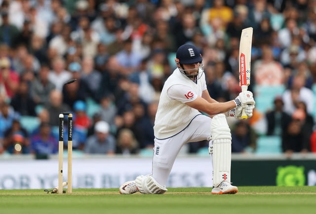 Cricket - International Test Match Series - Fifth Test - England v India - Kia Oval, London, Britain - August 4, 2025 England's Gus Atkinson is bowled by India's Mohammed Siraj to win the match for India and draw the test series Action Images via Reuters/Paul Childs