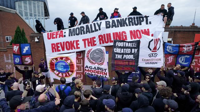 Palace fans protest against the Uefa ruling outside Selhurst Park
