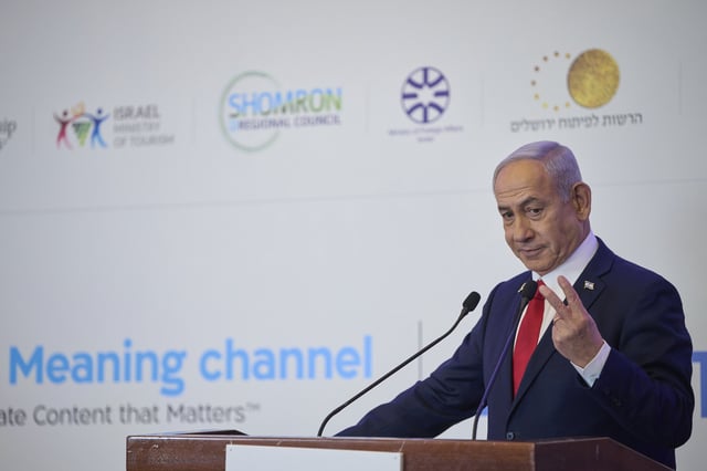 Israeli Prime Minister Benjamin Netanyahu speaks to the audience at a conference in Jerusalem, Sunday, July 27, 2025. (AP Photo/Ohad Zwigenberg)