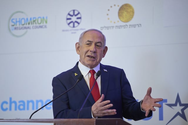 Israeli Prime Minister Benjamin Netanyahu speaks to the audience at a conference in Jerusalem, Sunday, July 27, 2025. (AP Photo/Ohad Zwigenberg)