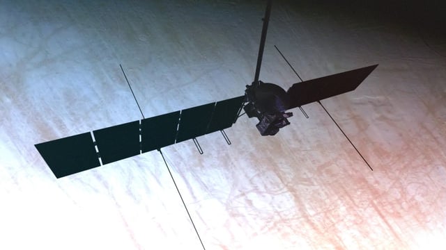 This artist’s concept of Europa Clipper shows the spacecraft silhouetted against Europa’s surface, with its long radar antennas - seen at the lower edge of the solar panels - fully deployed. The antennas are key components of the spacecraft’s radar instrument, called REASON. Image via NASA/ JPL-Caltech.