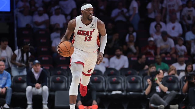 Apr 26, 2025; Miami, Florida, USA; Miami Heat center Bam Adebayo (13) dribbles the basketball against the Cleveland Cavaliers in the third quarter during game three for the first round of the 2025 NBA Playoffs at Kaseya Center. Mandatory Credit: Sam Navarro-Imagn Images