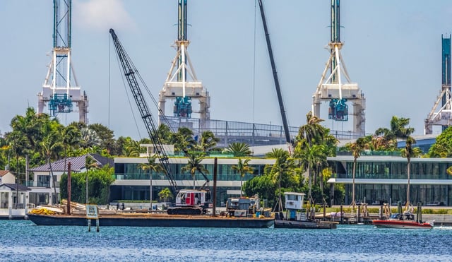 A U.S. CostGuard vessel (far right) seen next to a barge that hit a sailboat that sank off Miami Beach’s Hibiscus Island in Biscayne Bay on July 28, 2025. Five children and a camp counselor were aboard the sailboat, part of a Miami Yacht Club summer camp. (Pedro Portal/Miami Herald/TNS)