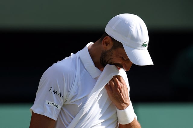 Tennis - Wimbledon - All England Lawn Tennis and Croquet Club, London, Britain - July 11, 2025 Serbia's Novak Djokovic reacts during his semi final match against Italy's Jannik Sinner REUTERS/Toby Melville/File Photo