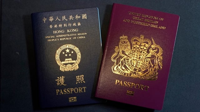 A British National Overseas passport, right, and a a Hong Kong Special Administrative Region of the People's Republic of China passport are pictured in this January 2021 file photo.