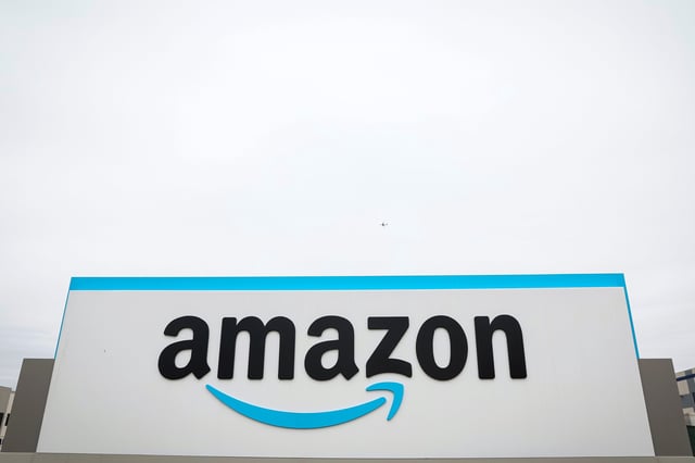 The Amazon logo is displayed on a sign outside the company's LDJ5 sortation center, as employees begin voting to unionize a second warehouse in the Staten Island borough of New York City, U.S. April 25, 2022.