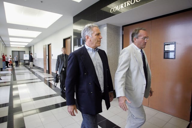 This 2008 photo shows Jeffrey Epstein as he enters a Palm Beach County courtroom in Florida.