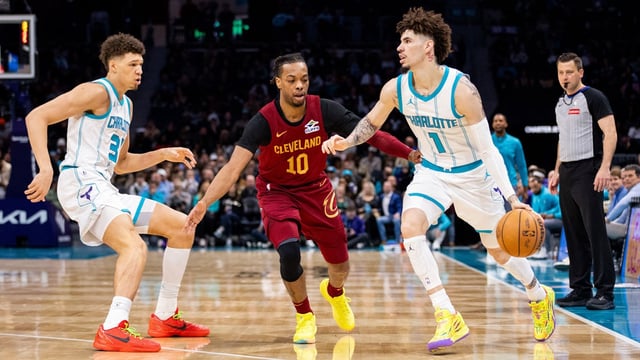 Mar 7, 2025; Charlotte, North Carolina, USA; Charlotte Hornets guard LaMelo Ball (1) drive on Cleveland Cavaliers guard Darius Garland (10) during the second quarter at Spectrum Center. Mandatory Credit: Scott Kinser-Imagn Images