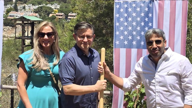 Mike Johnson, centre with his wife Kelly Lary and the Ariel mayor Yair Chetboun, right, was the highest-ranking US official to visit an Israeli settlement.