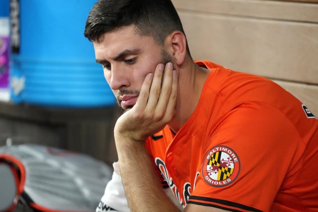 Baltimore Orioles’ Grayson Rodriguez sits in the dugout during a baseball game against the Texas Rangers Saturday, July 20, 2024, in Arlington, Texas. (AP Photo/Jeffrey McWhorter)