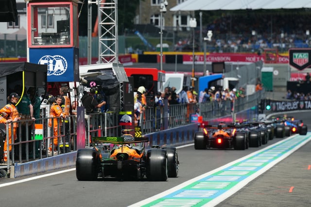 Formula One drives line up on the pit lane before the start of the first practice session of the Formula One Belgian Grand Prix at the Spa-Francorchamps circuit in Spa, on July 25, 2025.