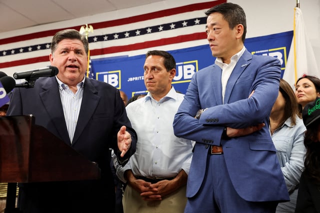 Illinois Governor J.B. Pritzker speaks near Texas State Rep. Gene Wu and Texas State Rep. Trey Martinez as Democratic lawmakers from Texas hold a press conference, after leaving their state to deny Republicans the quorum needed to redraw the state's 38 congressional districts, in Carol Stream, Illinois, U.S. August 3, 2025. REUTERS/Tom Krawczyk