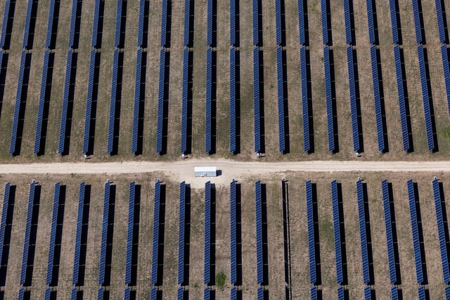 An aerial view shows rows of solar panels at a solar farm in Anson, Texas, U.S., April 23, 2025. REUTERS/Daniel Col/File Photo