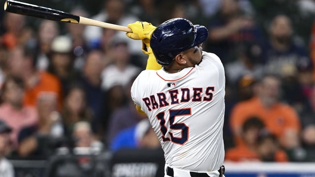Jun 25, 2025; Houston, Texas, USA; Houston Astros third baseman Isaac Paredes (15) at bat in the third inning against the Philadelphia Phillies at Daikin Park. Mandatory Credit: Maria Lysaker-Imagn Images