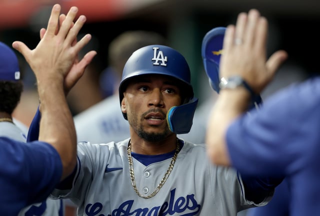 CINCINNATI, OHIO - JULY 28: Mookie Betts #50 of the Los Angeles Dodgers celebrates after scoring in the first inning against the Cincinnati Reds at Great American Ball Park on July 28, 2025 in Cincinnati, Ohio.