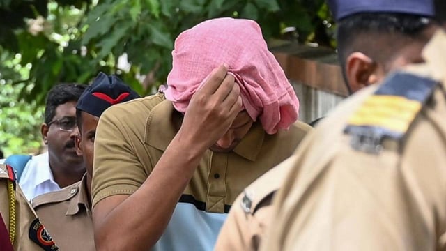 Clad in a t-shirt and trousers, the 35-year-old Chetan Singh Chaudhary presented a picture of docility as he was led into and out of the courtroom by policemen (Raju Shinde/ HT Photo)