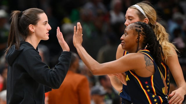 Aug 3, 2025; Seattle, Washington, USA; Indiana Fever guard Caitlin Clark (22) and guard Kelsey Mitchell (0) celebrate defeating the Seattle Storm at Climate Pledge Arena. Mandatory Credit: Steven Bisig-Imagn Images