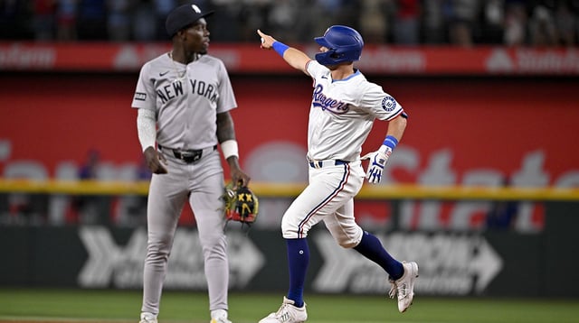 Aug 4, 2025; Arlington, Texas, USA; Texas Rangers designated hitter Josh Jung (6) rounds the bases past New York Yankees second baseman Jazz Chisholm Jr. (13) after Jung hits a game winning home run during the tenth inning at Globe Life Field. Mandatory Credit: Jerome Miron-Imagn Images.