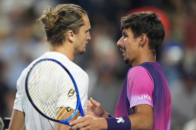 Aug 4, 2025; Toronto, ON, Canada; Alexei Popyrin (AUS) (right) congratulates Alexander Zverev (GER) left on his win during quarterfinals at Sobeys Stadium. Mandatory Credit: John E. Sokolowski-Imagn Images
