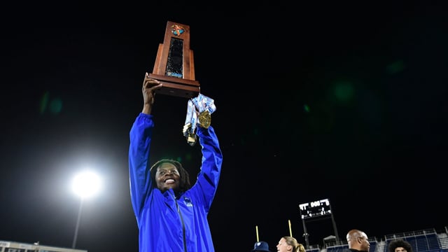 Miami Northwestern&#39;s Teddy Bridgewater raises the state trophy following the team&#39;s win over Raines in the Class 3A championship on Dec. 14, 2024.