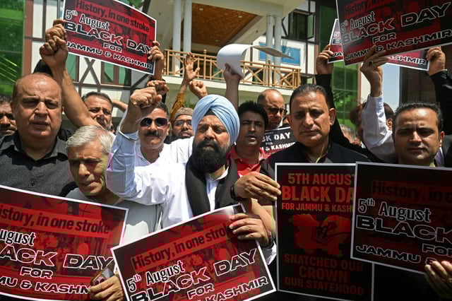 Protesters in Srinagar call for the restoration of state-hood for Kashmir, which has been under direct rule from New Delhi for six years
